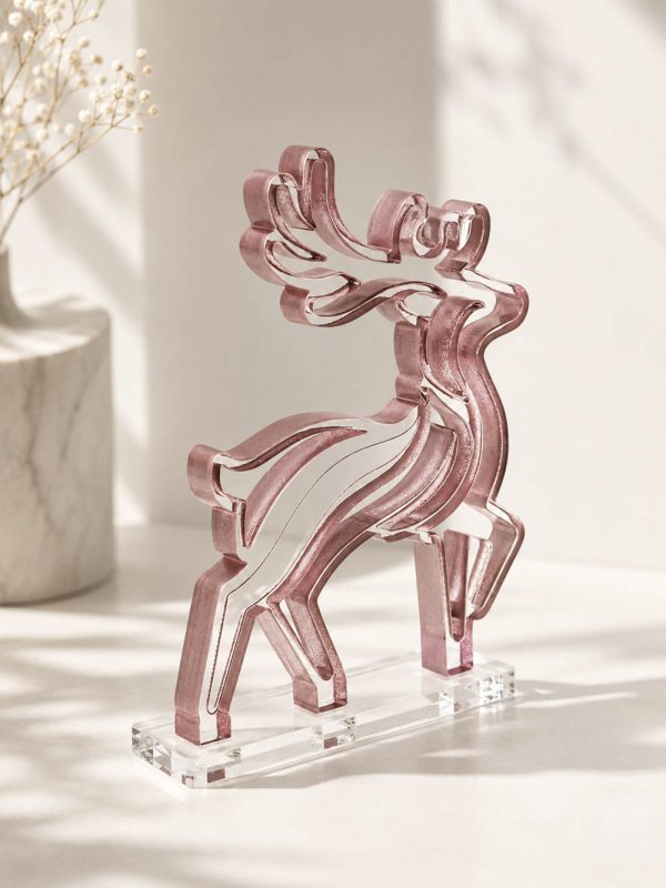 Γούρι Armonia Reindeer με ροζ καμπύλες, καθαρή γραμμή και ζωηρή κίνηση.