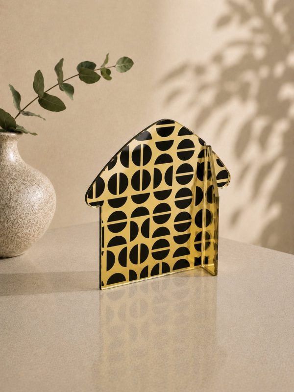 Γούρι BauLine Home Demi Aurum με χρυσά και μαύρα ημικύκλια Demi σε ισορροπημένη σιλουέτα οικίας.